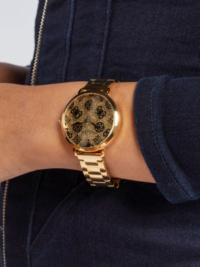 Otkrijte GUESS "Sugarplum" ženski sat u zlatnoj boji s G-božur printom i sjajnim cirkonima. Elegancija i trend u jednom.
